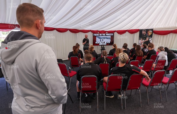 250923 - Wales Women Training Camp, North Wales - Mike Hill leads the team meeting ahead of a training session during their squad camp ahead of the match against USA