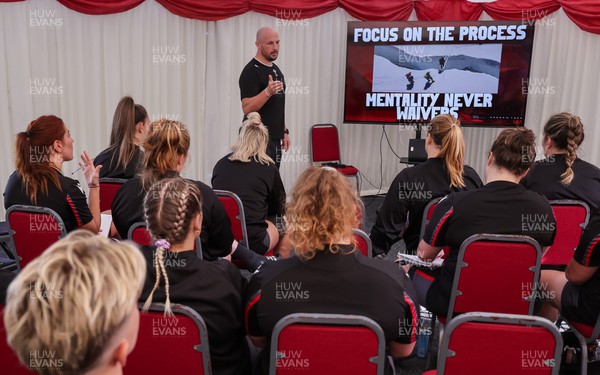 250923 - Wales Women Training Camp, North Wales - Mike Hill leads the team meeting ahead of a training session during their squad camp ahead of the match against USA
