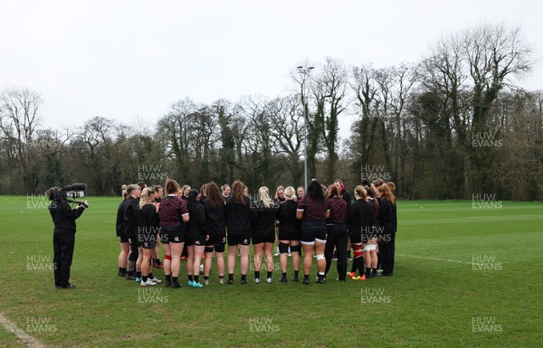 260324 - Wales Women Rugby Training Session - The Wales team huddle up during a training session   ahead of their 6 Nations match against England