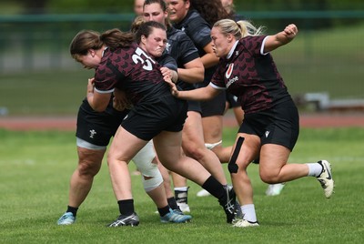 260625  Wales Women Rugby Training Session - Maisie Davies takes on Abbey Constable during training ahead of the Wales matches against Australia