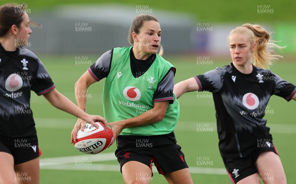 260923 - Wales Women Rugby Training Session - Jazz Joyce gets away from Cath Richards during a training session at Stadium CSM, north Wales