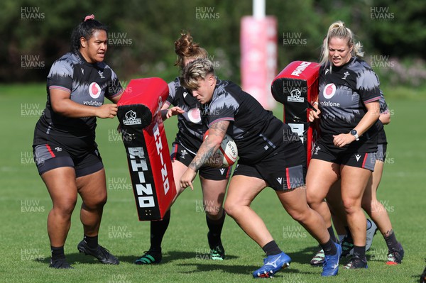 280823 - Wales Women Training Session - Left to right, Sisilia Tuipulotu, Donna Rose, and Kelsey Jones during training session