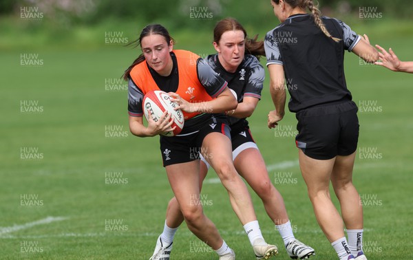 280823 - Wales Women Training Session - Nel Metcalfe is held by Sian Jones during training session