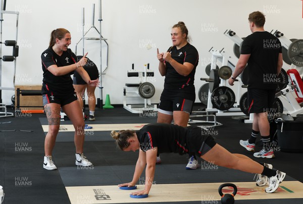 280823 - Wales Women Training Session - Georgia Evans and Carys Phillips share a joke during gym session
