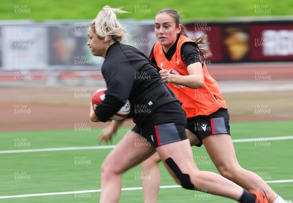 280923 - Wales Women Rugby Training Session - Hannah Bluck takes on Nel Metcalfe during a training session ahead of the match against USA at Stadium CSM