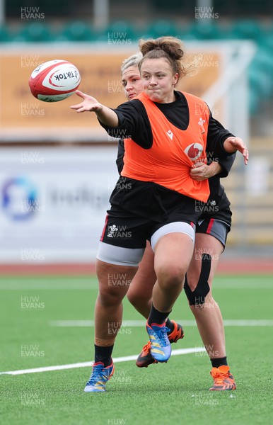 280923 - Wales Women Rugby Training Session - Lleucu George offloads during a training session ahead of the match against USA at Stadium CSM