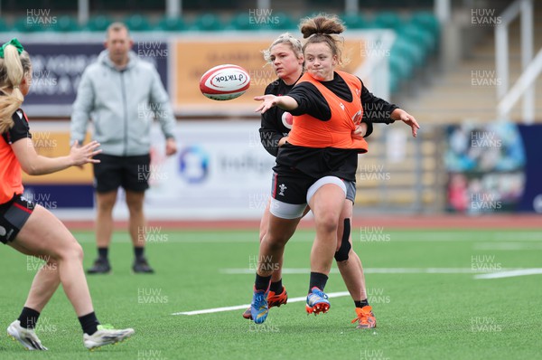280923 - Wales Women Rugby Training Session - Lleucu George offloads during a training session ahead of the match against USA at Stadium CSM