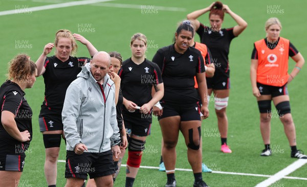 280923 - Wales Women Rugby Training Session - Coach Mike Hill works with the forwards during a training session ahead of the match against USA at Stadium CSM