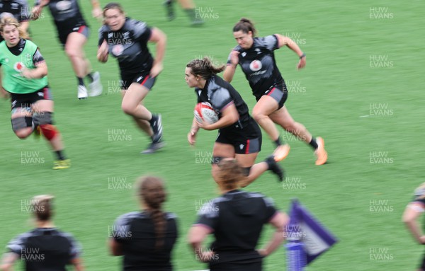 280923 - Wales Women Rugby Training Session - Bryonie King breaks away during a training session ahead of the match against USA at Stadium CSM