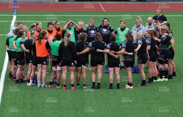 280923 - Wales Women Rugby Training Session - The Wales team huddle together during a training session ahead of the match against USA at Stadium CSM
