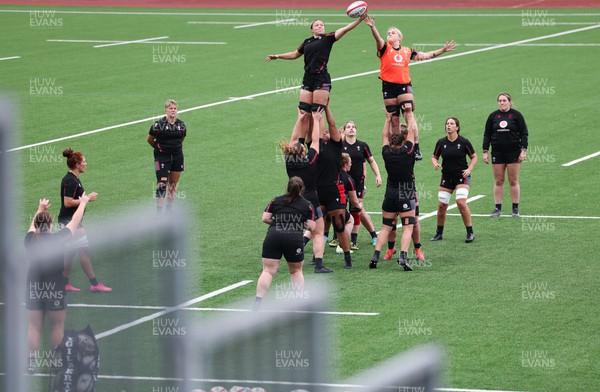 280923 - Wales Women Rugby Training Session - Alisha Butchers and Alex Callender contest a line out during a training session ahead of the match against USA at Stadium CSM