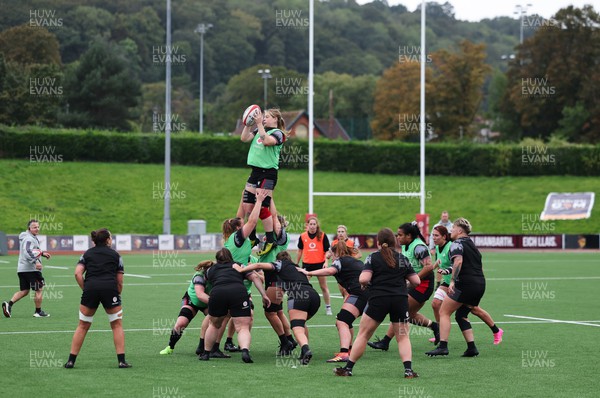 280923 - Wales Women Rugby Training Session - Bethan Lewis takes the line out during a training session ahead of the match against USA at Stadium CSM