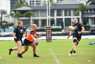 290725 - Wales Women Rugby Training at The Southport School - Molly Reardon passes to Alaw Pyrs during a Wales Women’s rugby training session ahead of the second test against Australia