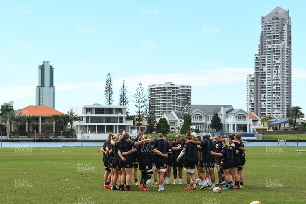 290725 - Wales Women Rugby Training at The Southport School - The Wales Women’s rugby squad huddle up during a training session ahead of the second test against Australia