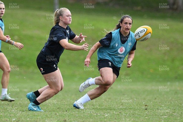290725 - Wales Women Rugby Training at The Southport School - Seren Lockwood passes the ball watched by Kayleigh Powell during a Wales Women’s rugby training session ahead of the second test against Australia