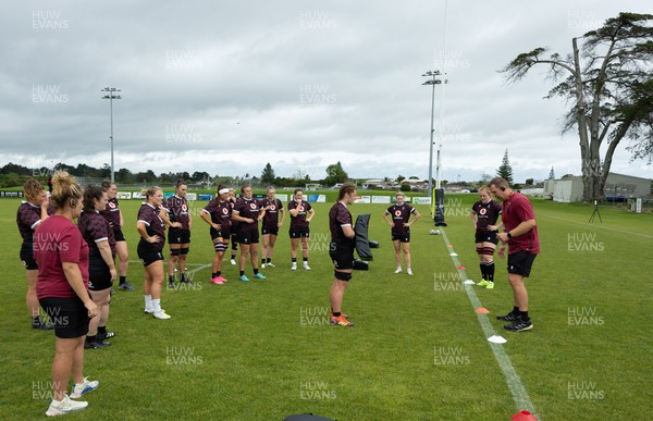 301023 - Wales Women Rugby Training Session - Head coach Ioan Cunningham and coach Catrina Nicholas-McLaughlin work on tackle technique during a training session at Pakuranga United RFC ahead of their WXV1 match against Australia