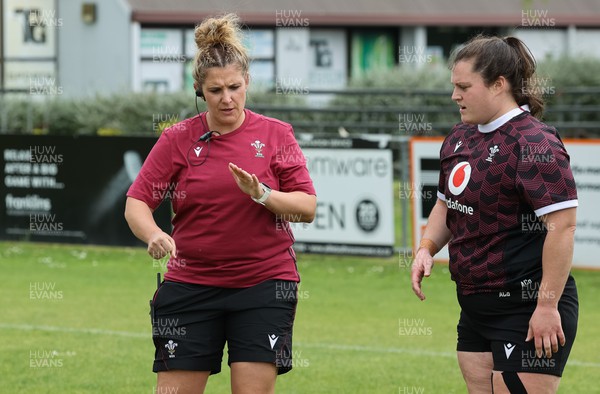 301023 - Wales Women Rugby Training Session - Coach Catrina Nicholas-McLaughlin works with Abbey Constable during a training session at Pakuranga United RFC ahead of their WXV1 match against Australia