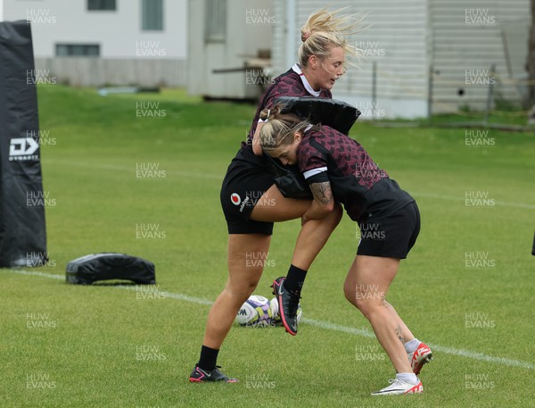 301023 - Wales Women Rugby Training Session - Meg Webb and Keira Bevan during a training session at Pakuranga United RFC ahead of their WXV1 match against Australia