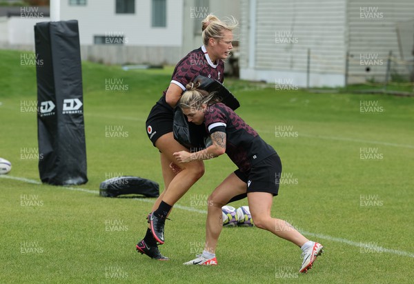 301023 - Wales Women Rugby Training Session - Meg Webb and Keira Bevan during a training session at Pakuranga United RFC ahead of their WXV1 match against Australia