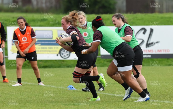 301023 - Wales Women Rugby Training Session - Abbie Fleming breaks away during a training session at Pakuranga United RFC ahead of their WXV1 match against Australia