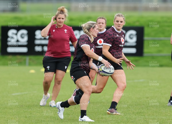 301023 - Wales Women Rugby Training Session - Kerin Lake passes to Carys Williams-Morris during a training session at Pakuranga United RFC ahead of their WXV1 match against Australia