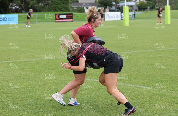 301023 - Wales Women Rugby Training Session - Coach Catrina Nicholas-McLaughlin works with Meg Webb during a training session at Pakuranga United RFC ahead of their WXV1 match against Australia