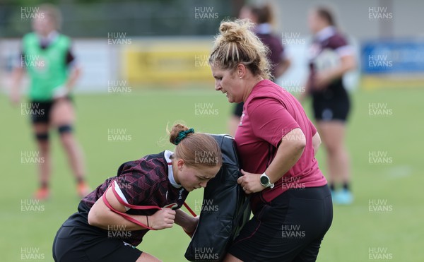 301023 - Wales Women Rugby Training Session - Coach Catrina Nicholas-McLaughlin works with Niamh Terry during a training session at Pakuranga United RFC ahead of their WXV1 match against Australia