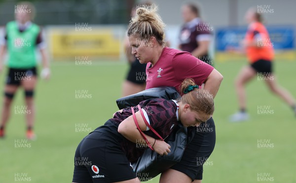 301023 - Wales Women Rugby Training Session - Coach Catrina Nicholas-McLaughlin works with Niamh Terry during a training session at Pakuranga United RFC ahead of their WXV1 match against Australia