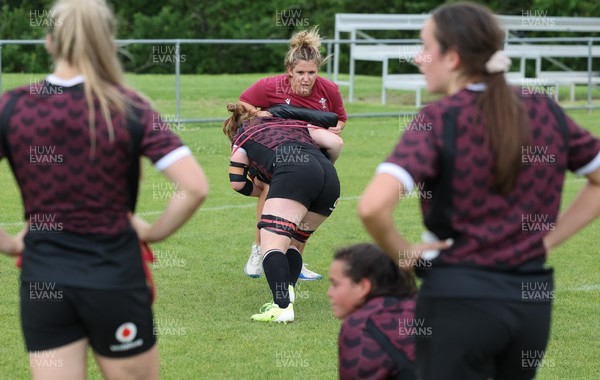 301023 - Wales Women Rugby Training Session - Coach Catrina Nicholas-McLaughlin works with Abbie Fleming during a training session at Pakuranga United RFC ahead of their WXV1 match against Australia