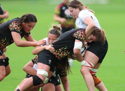 090926 - Wales Women Rugby Training Match - Kate Williams is tackled during a training match ahead of the WRX Series of matches 