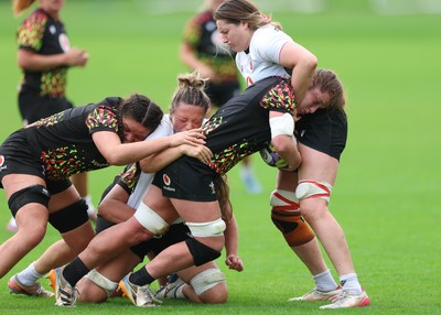 090926 - Wales Women Rugby Training Match - Kate Williams is tackled during a training match ahead of the WRX Series of matches 