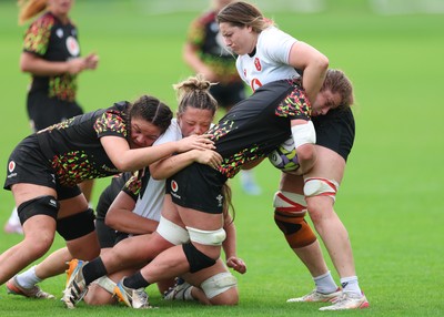 090926 - Wales Women Rugby Training Match - Kate Williams is tackled during a training match ahead of the WRX Series of matches 
