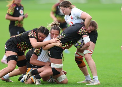 090926 - Wales Women Rugby Training Match - Kate Williams is tackled during a training match ahead of the WRX Series of matches 
