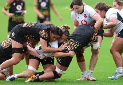 090926 - Wales Women Rugby Training Match - Kate Williams is tackled during a training match ahead of the WRX Series of matches 