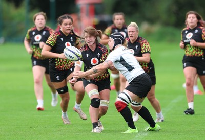 090926 - Wales Women Rugby Training Match - Kate Williams is tackled by Bethan Lewis during a training match ahead of the WRX Series of matches 