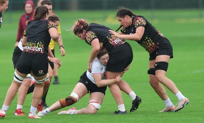090926 - Wales Women Rugby Training Match - Stella Orrin is tackled by Gwen Crabb during a training match ahead of the WRX Series of matches 