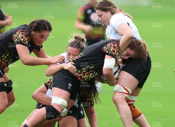 090926 - Wales Women Rugby Training Match - Kate Williams is tackled during a training match ahead of the WRX Series of matches 