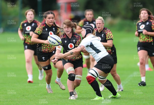 090926 - Wales Women Rugby Training Match - Kate Williams is tackled by Bethan Lewis during a training match ahead of the WRX Series of matches 