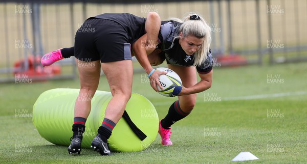 111022 - Wales Women Rugby Training Session - Wales’ Lowri Norkett is tackled during training session ahead of their Women’s Rugby World Cup match against New Zealand