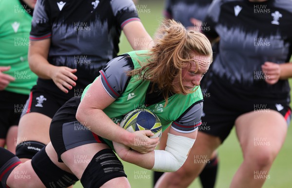 111022 - Wales Women Rugby Training Session - Wales’ Abbie Fleming is tackled during training session ahead of their Women’s Rugby World Cup match against New Zealand
