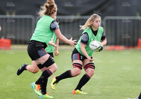 111022 - Wales Women Rugby Training Session - Wales’ Bethan Lewis passes to Abbie Fleming during training session ahead of their Women’s Rugby World Cup match against New Zealand