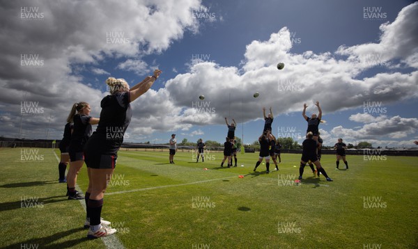 111022 - Wales Women Rugby Training Session - Left to right Wales’ Carys Phillips, Kat Evans and Kelsey Jones take line outs  during training session ahead of their Women’s Rugby World Cup match against New Zealand