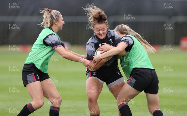 141022 - Wales Women Rugby Training Session - Wales’ Lleucu George is held during training ahead of the Women’s Rugby World Cup match against New Zealand