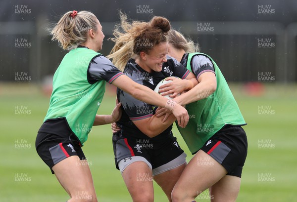 141022 - Wales Women Rugby Training Session - Wales’ Lleucu George is held during training ahead of the Women’s Rugby World Cup match against New Zealand