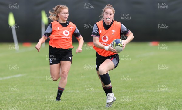 191022 - Wales Women Rugby Training Session - Wales’s Lisa Neumann breaks as Niamh Terry looks on during training ahead of their Women’s Rugby World Cup match against Australia