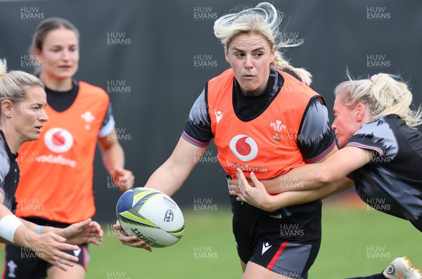 191022 - Wales Women Rugby Training Session - Wales’s Carys Williams-Morris is tackled by Kerin Lake and Megan Webb during training ahead of their Women’s Rugby World Cup match against Australia