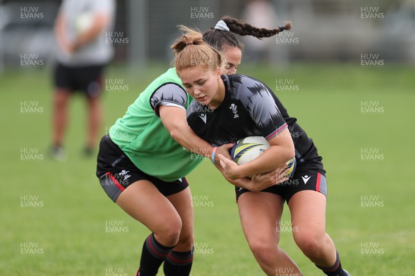 251022 - Wales Women Rugby Training Session - Niamh Terry of Wales takes on Ffion Lewis of Wales during training ahead of their Women’s Rugby World Cup Quarter Final against New Zealand