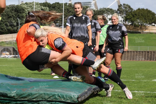 270922 - Wales Women Rugby Training Session - Wales’ Kayleigh Powell is tackled by Lowri Norkett during training ahead of the start of the Women’s Rugby World Cup