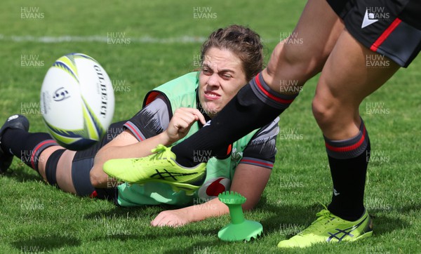 270922 - Wales Women Rugby Training Session - Wales’ Natalia John controls the ball movement for kicker Elinor Snowsill during training ahead of the start of the Women’s Rugby World Cup