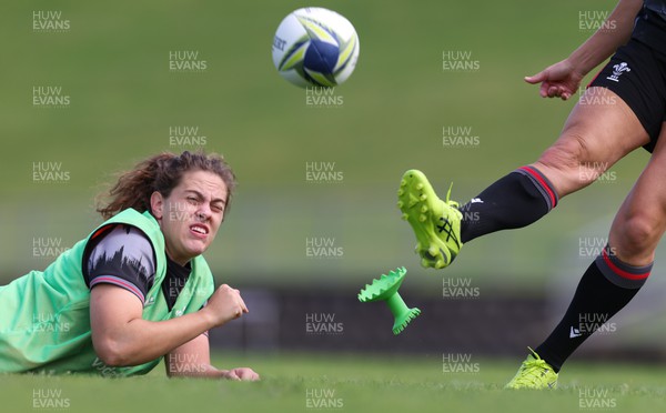 270922 - Wales Women Rugby Training Session - Wales’ Natalia John controls the ball movement for kicker Elinor Snowsill during training ahead of the start of the Women’s Rugby World Cup